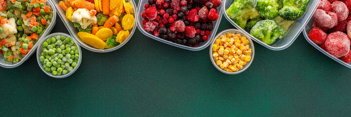Food in winter, freezing fresh vegetables in summer in the refrigerator, various frozen vegetables in plastic dishes on a green background, banner