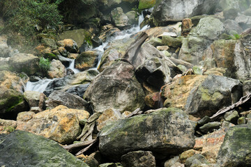Serene Cascade Through Rocky Terrain