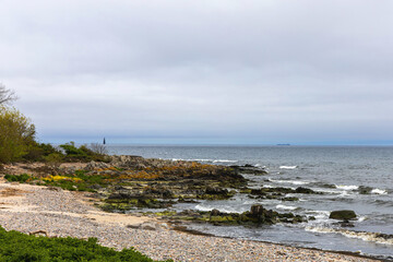 Sea sandy beach in cloudy weather. Seascape
