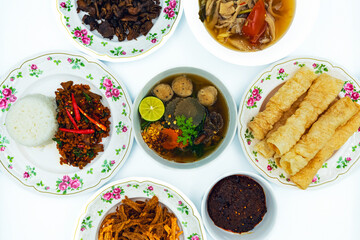 Set of dishes for healthy food on white background. Vegetarian food concept. Set of healthy vegetarian food. Vegetables, fruit, seeds, cereals, beans, spices, superfoods, herbs, condiment for vegan.