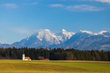 Fototapeta premium Landscape with church near Kranj, Slovenia