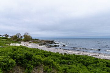 Sea sandy beach in cloudy weather. Seascape