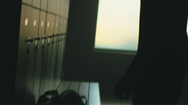 Frustrated para-runner in a locker room