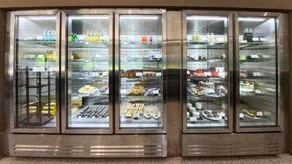 a display case full of delicious bread and cakes