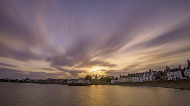 wide angle timelapse of evening sky over Anstruther, coastal Scottish town, clouds rushing towards camera
