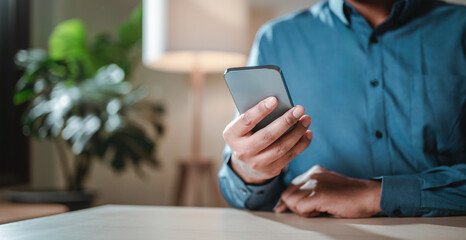 typing, wireless, technology, online, smartphone, touch, message, social, internet, network. A man is holding a cell phone. Concept of the importance of staying connected in today's world.