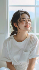 A striking portrait of a young Asian woman wearing an white t-shirt, exuding natural beauty and contemporary style.