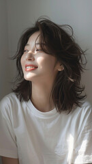 A striking portrait of a young Asian woman wearing an white t-shirt, exuding natural beauty and contemporary style.
