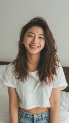 A striking portrait of a young Asian woman wearing an white t-shirt, exuding natural beauty and contemporary style.