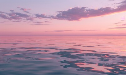 Fototapeta premium serene sunset over the ocean, with the sky painted in soft pink and purple hues and the calm water reflecting the colors
