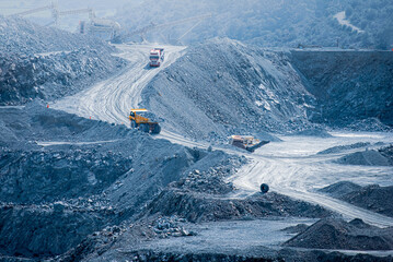 Active diabase quarry with trucks and conveyor belts. Parekklisia, Cyprus