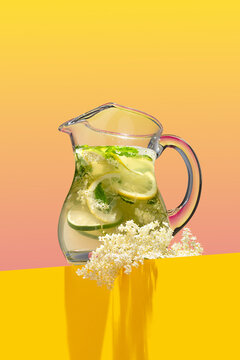 Homemade fresh elderflower lemonade garnished with lemon peel and a blooming branch