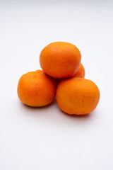 Fresh oranges on a white background, showcasing vibrant colors and natural texture, ideal for food, health, and lifestyle projects.