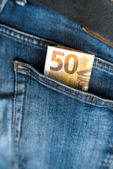 Euro, money in jeans pocket. Savings for a rainy day.
