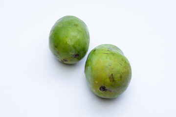 Fresh mango fruit on a white background, highlighting its vibrant yellow color and smooth texture, perfect for food photography and advertising