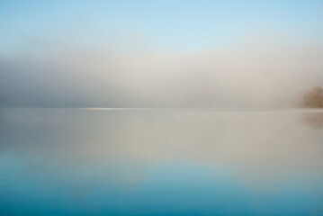 blue lake in dawn fog, nice autumn background
