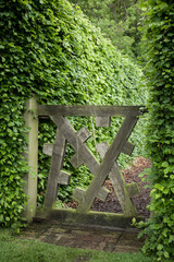 Unusual garden gate in an old English garden