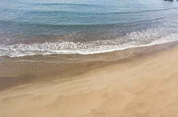 Drone point of view of desert beach and seashore on South of Tenerife in early morning