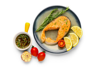 Plate of tasty fried salmon steak with lemon on white background