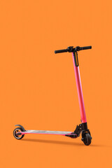 Pink modern electric kick scooter on orange background