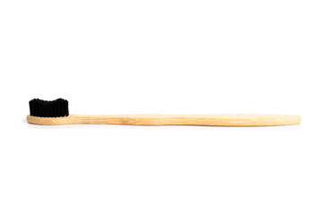 Wooden toothbrush on white background