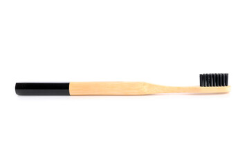 Wooden toothbrush on white background