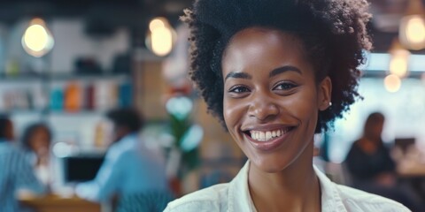 A happy woman smiling directly at the camera with a friendly expression