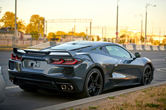 Minsk, Belarus. Jul 10, 2023. Chevrolet Corvette Stingray parked at roadside in the city. Chevrolet Corvette C8 razor-sharp aerodynamics. Rear body exterior, taillights. Aggressive design