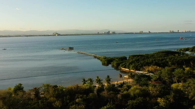 Olango Island with marine sanctuary and beach. Drone view of tropical rainforest. Lapu-Lapu, Philippines. Cebu.