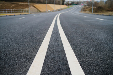 Asphalt highway with road markings lines