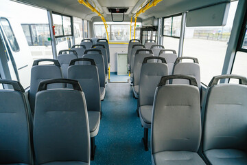 Empty bus interior. Seats without passengers. Public transport.