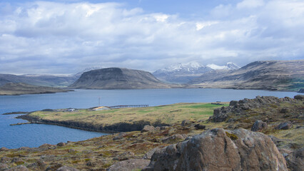 Icelandic landscape with mountains, fjord and blue sky with clouds, Hvalfjördur