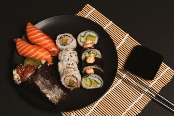 Sushi collection, isolated on black background, medium sushi set on black background, Sushi on a black background
