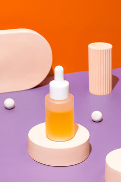 Dropper bottle showcased on circular podium against dual-tone backdrop
