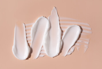Cosmetic smear of cream texture on a pastel background. Skin care.