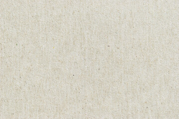 A sheet of beige recycled cardboard texture as background