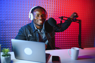 African american video blogger records content in his studio.