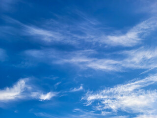 Beautiful blue sky and feathery white clouds nice bright day