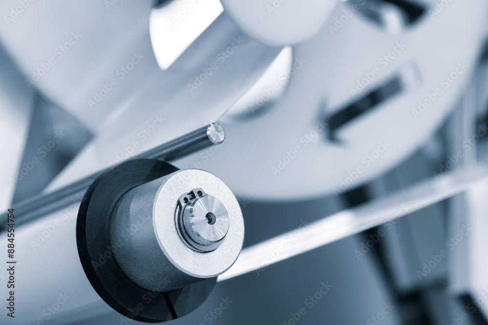 Poster a roll of white paper is passed through the machine. printer and sticker machine, which is used for 