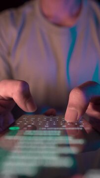 Close up view of man's hands typing a message on a smart phone, typing a text message, touching a touch screen keyboard. Concept of using messenger app. Online chat concept