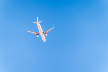 Airplane before landing in blue sky, Airbus A321-200