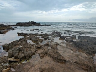 Rocky shore  with blue sea - Adriatic Sea, Prematura, Medulin, Croatia