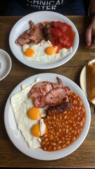 Full english breakfast, two white plates