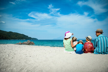 happy family at sea in greece on nature background