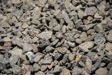 A close up view of a pile of gray crushed stone gravel