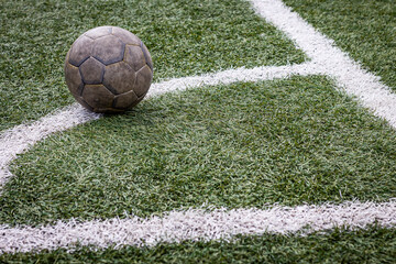 soccer ball on the corner kick mark.
Football field, stadium.