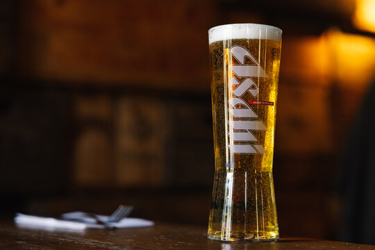Pint of Asahi lager on a wooden table