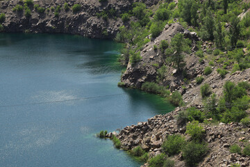 Rocky shore of a lake in the mountains