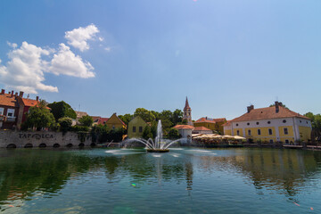 A town of Tapolca in Balaton region of Hungary with lake in the middle of the city and fountain, carps in the lake