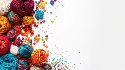 Vibrant yarn and beads on white background with space for text